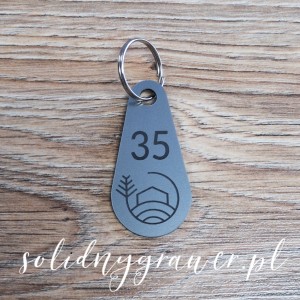 Mały breloczek plastikowy 5x3 cm srebrny
